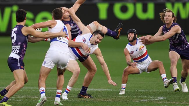 PERTH, AUSTRALIA - JUNE 06: Sean Darcy of the Dockers and Stefan Martin of the Bulldogs contest the ruck during the round 12 AFL match between the Fremantle Dockers and the Western Bulldogs at Optus Stadium on June 06, 2021 in Perth, Australia. (Photo by Paul Kane/Getty Images)