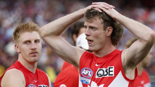 MELBOURNE, AUSTRALIA - SEPTEMBER 28: Matt Roberts and Nick Blakey of the Swans look dejected after the AFL Grand Final match between Sydney Swans and Brisbane Lions at Melbourne Cricket Ground, on September 28, 2024, in Melbourne, Australia. (Photo by Daniel Pockett/AFL Photos/Getty Images)