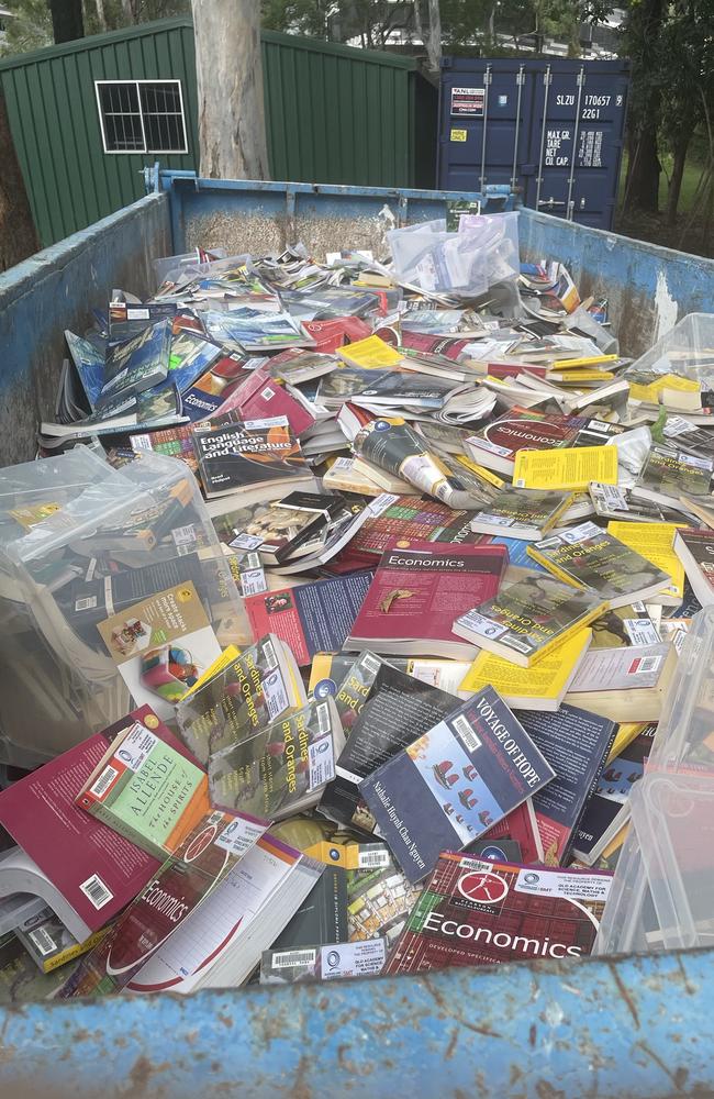 Textbooks in a skip at Queensland Academy for Science Mathematics and Technology. Picture: Supplied