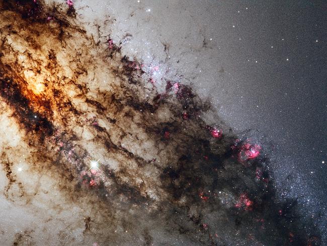 Centaurus A, also known as NGC 5128, is well known for its dramatic dusty lanes of dark material. Hubble's new observations, using its most advanced instrument, the Wide Field Camera 3, are the most detailed ever made of this galaxy. 