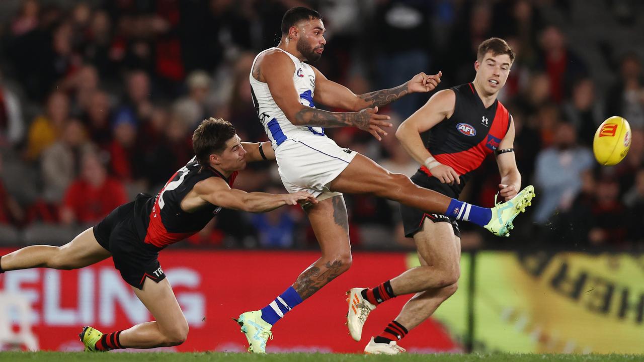 MELBOURNE - JUNE 4 , 2023. AFL Round 12. Tarryn Thomas of the Kangaroos drives the ball inside 50 during the match between Essendon and North Melbourne at Marvel Stadium on June the 4th, 2023, in Melbourne, Australia. Photo by Michael Klein. . Photo by Michael Klein.