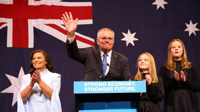 ‘I was exhausted, physically and emotionally’ … then-PM Scott Morrison, flanked by wife Jenny and daughters Lily and Abbey Morrison, concedes defeat at the Liberal party election event in Sydney following the Federal Election on May 21, 2022. He was succeeded in the top job by Labor’s Anthony Albanese.