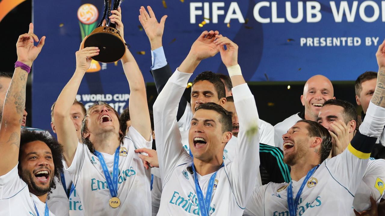 Real Madrid celebrate with the FIFA Club World Cup trophy following their victory in the 2017 final in Abu Dhabi.