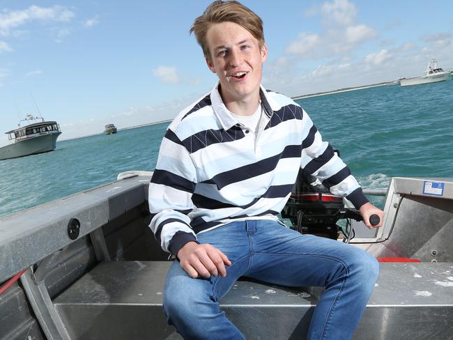 14.11.2015. EMBARGOED EMBARGOED EMBARGOED. Glenelg country footballer and top draft prospect Mason Redman. Pictured with his dad Joel at Southend where the family cray boats are based and then running while his dad follows behind him in his car timing him with a stopwatch. That's how he built his fitness base. pic tait schmaal