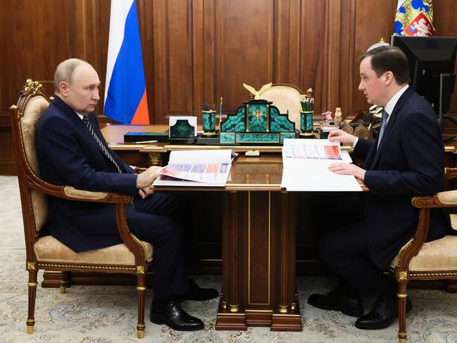 Russian President Vladimir Putin, speaks with the governor of Arkhangelsk region Alexander Tsybulsky during their meeting at the Kremlin. Picture: Kremlin pool photo via AP