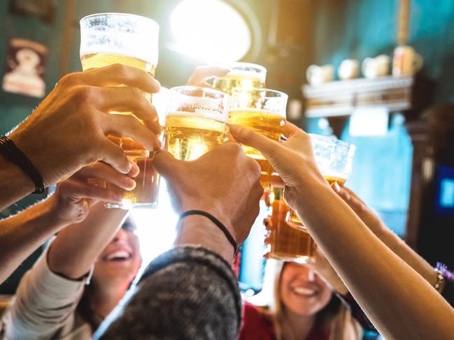 ESCAPE: UK Drink, Mikaella Clements -  Group of happy friends drinking and toasting beer at brewery bar restaurant - Friendship concept with young people having fun together at cool vintage pub - Focus on middle pint glass - High iso image . Picture: iStock