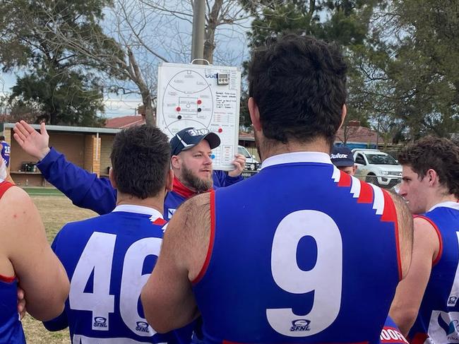 Keysy coach Chris Smith at the huddle.