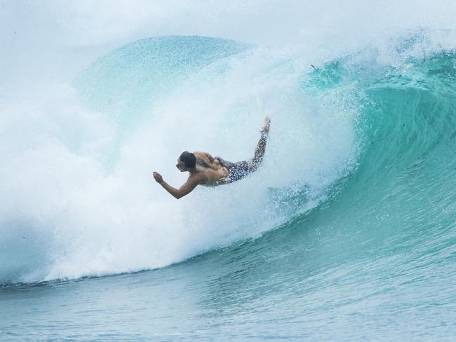 Surfer Jimmy Mancini loses his board on a big wave at Moffat Beach. Strong winds and large swell has arrived on the Sunshine coast as Cyclone Oma continues to track towards South East Queensland. Photo Lachie Millard