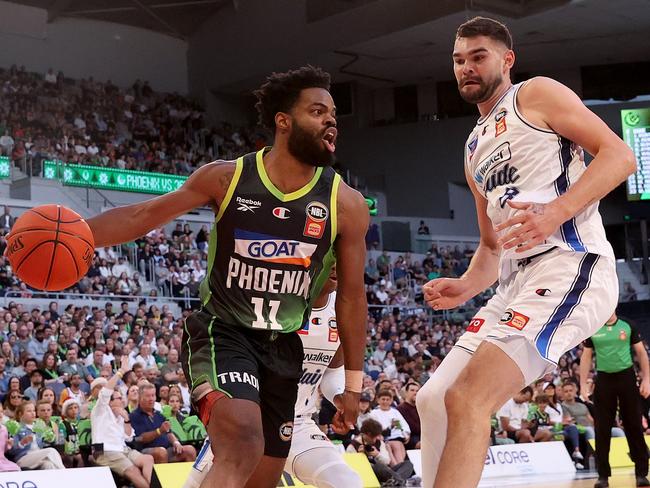 MELBOURNE, AUSTRALIA - DECEMBER 21: Derrick Walton Jr of the Phoenix dribbles the ball against Isaac Humphries of the 36ers during the round 13 NBL match between South East Melbourne Phoenix and Adelaide 36ers at John Cain Arena, on December 21, 2024, in Melbourne, Australia. (Photo by Kelly Defina/Getty Images)