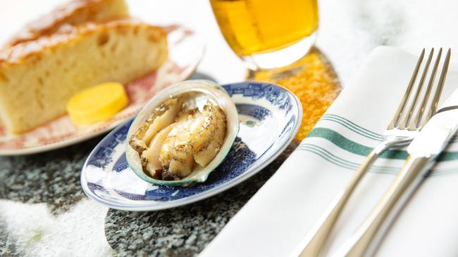 The grilled abalone with freshly baked focaccia. Picture: Mark Stewart