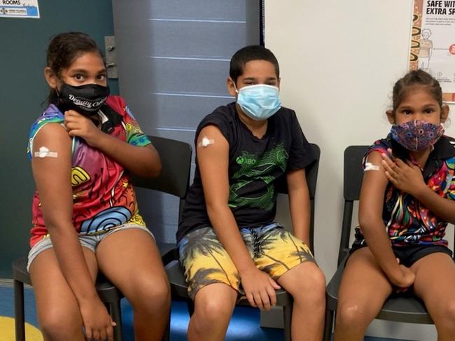 Naseli Kyle-Smith, Zamarys Andrews and Aaroshon Tyson all received their first COVID jab on Monday January 10, 2022, at the Workshop St Clinic in Yarrabah.