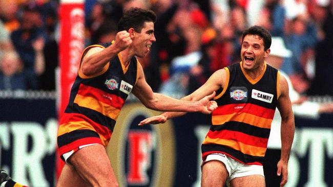 Darren Jarman, left, with Troy Bond after one of his five final-quarter goals in 1997 grand final.