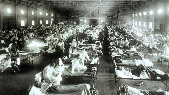 Soldiers from Fort Riley, Kansas, suffering from Spanish flu are hospitalised in a converted building at Camp Funston where some of the first cases of the outbreak were recorded.