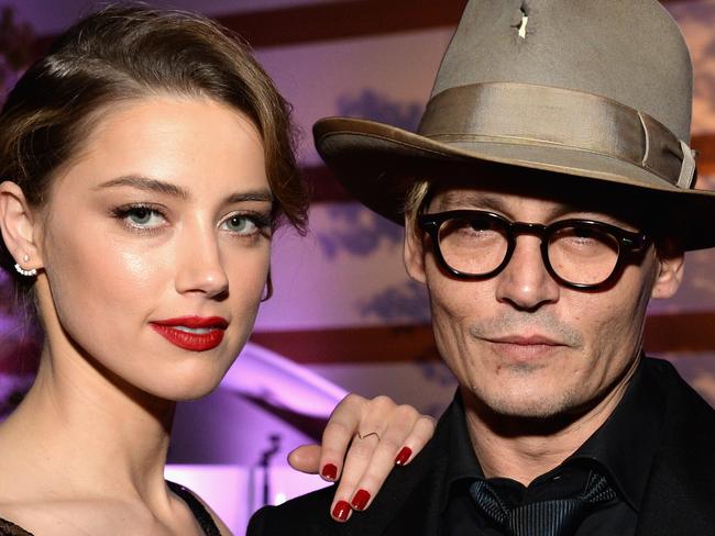 FILE PHOTO: Johnny Depp loses his libel case against the Sun newspaper LOS ANGELES, CA - JANUARY 11:  Actors Amber Heard (L) and Johnny Depp attend The Art of Elysium's 7th Annual HEAVEN Gala presented by Mercedes-Benz at Skirball Cultural Center on January 11, 2014 in Los Angeles, California.  (Photo by Michael Kovac/Getty Images for Art of Elysium)