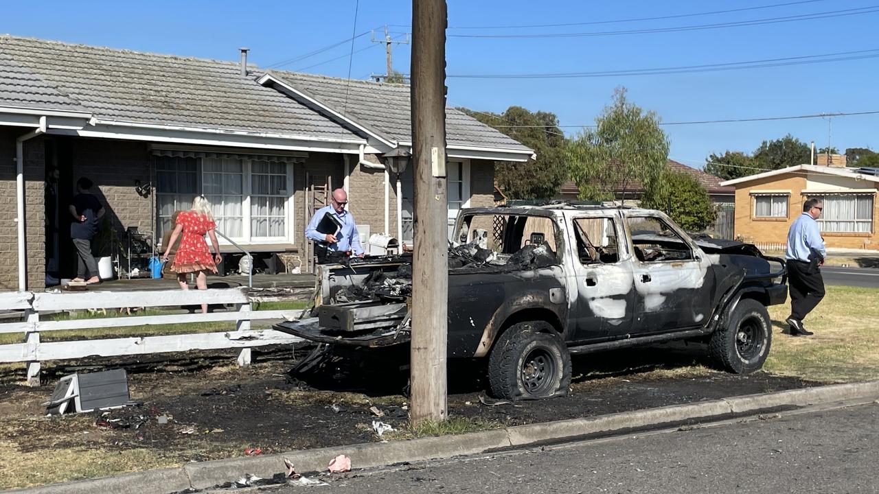 Detectives leave a Teleta Cres address after a ute went up in flames in suspicious circumstances.