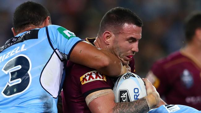 SYDNEY, AUSTRALIA — JUNE 21: Darius Boyd of the Maroons is tackled during game two of the State of Origin series between the New South Wales Blues and the Queensland Maroons at ANZ Stadium on June 21, 2017 in Sydney, Australia. (Photo by Cameron Spencer/Getty Images)