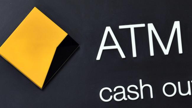 The logo of Australia's Commonwealth Bank is seen outside a branch in the central business district of Sydney on August 12, 2020. - Australia's Commonwealth Bank (CBA) reported an 11.3-percent drop in full-year cash profits as it took provisions against loan losses due to the COVID-19 coronavirus crisis. (Photo by Saeed KHAN / AFP)