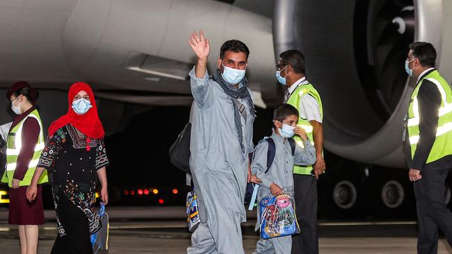 Families land in Doha in the early hours of Friday after being evacuated from Kabul. Picture: AFP