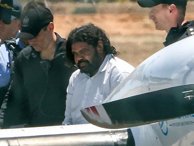 Terence Darrell Kelly being taken to prison in Perth.