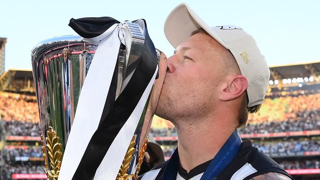 MELBOURNE, AUSTRALIA – SEPTEMBER 30: Jordan De Goey of the Magpies celebrates winning with the AFL Premiership Cup during the 2023 AFL Grand Final match between Collingwood Magpies and Brisbane Lions at Melbourne Cricket Ground, on September 30, 2023, in Melbourne, Australia. (Photo by Quinn Rooney/Getty Images)