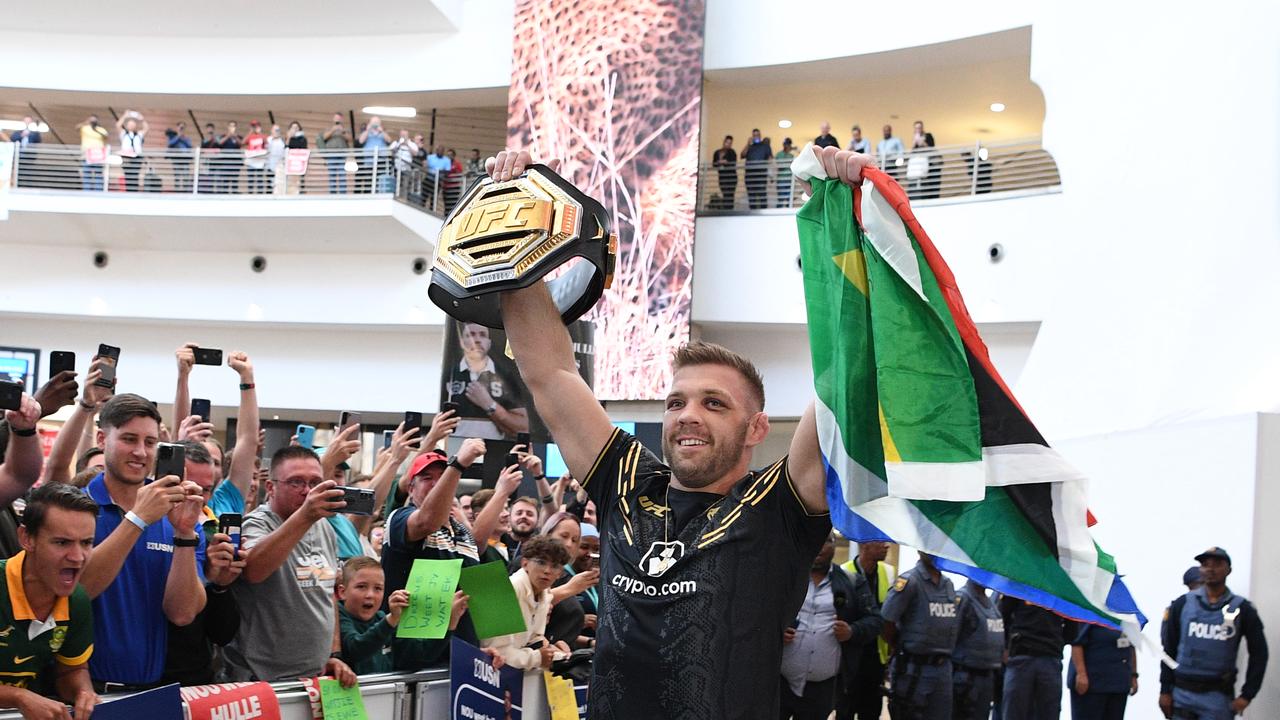 JOHANNESBURG, SOUTH AFRICA - JANUARY 25: UFC middleweight champion Dricus Du Plessis greets supporters as he arrives at O.R. Tambo International Airport on January 25, 2024 in Johannesburg, South Africa. (Photo by Lefty Shivambu/Gallo Images/Getty Images)