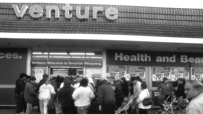 Shoppers rush into Venture department store in 1992.