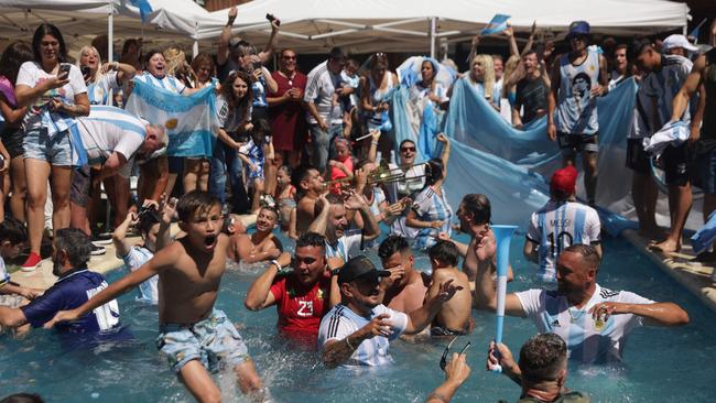 Fans of Argentina celebrate winning the Qatar 2022 World Cup at the former house of late football star Diego Maradona.