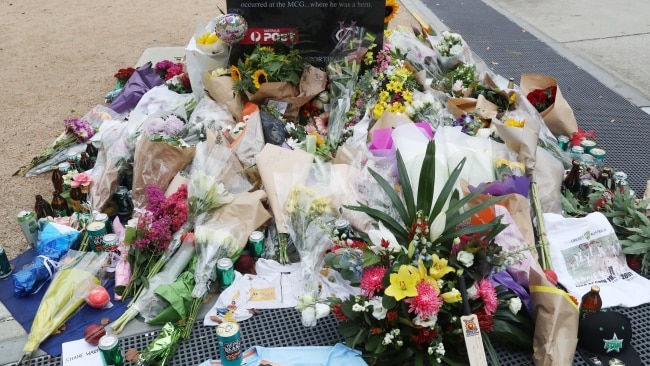 A floral tribute continues to grow at the Shane Warne Statue outside the MCG. Picture: NCA NewsWire / David Crosling