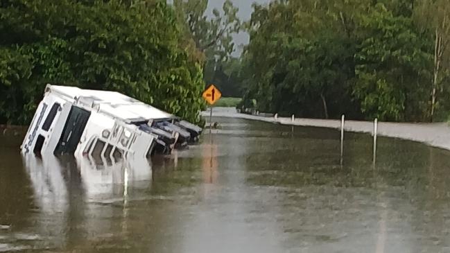 A truck came to grief attempting to navigate floodwaters covering the flood-prone Bruce Highway north of Ingham overnight. Picture: Supplied