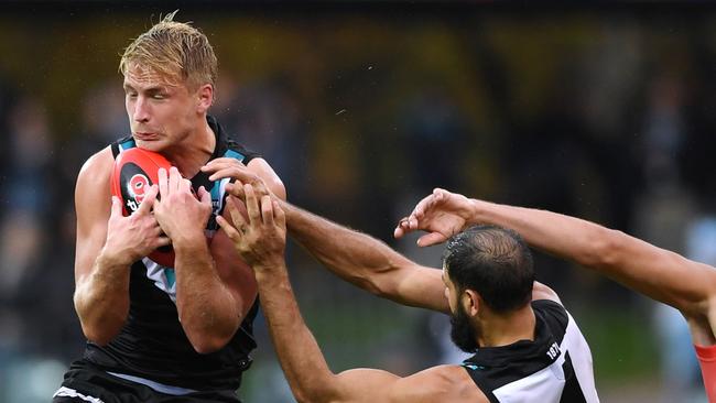 Billy Frampton takes a strong mark in front of teammate Paddy Ryder against Gold Coast on Sunday. Picture: MARK BRAKE (Getty Images)