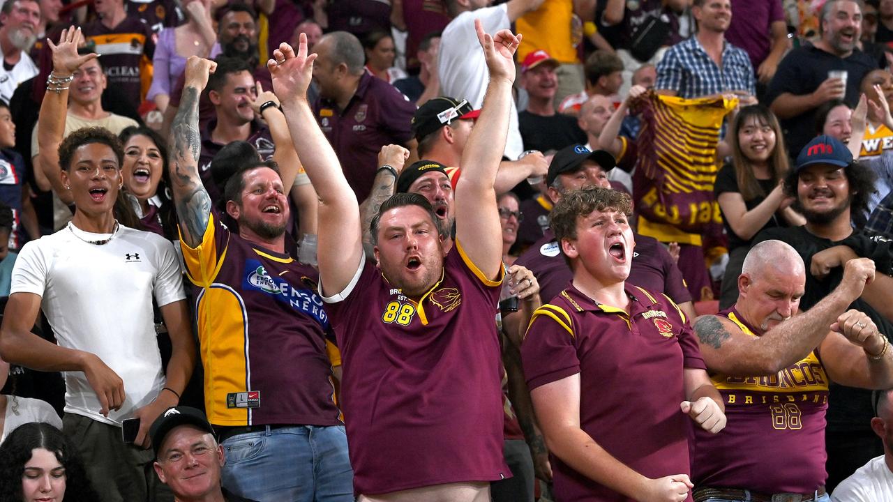 Broncos fans celebrate the match winning try by Kotoni Staggs. Picture: Getty