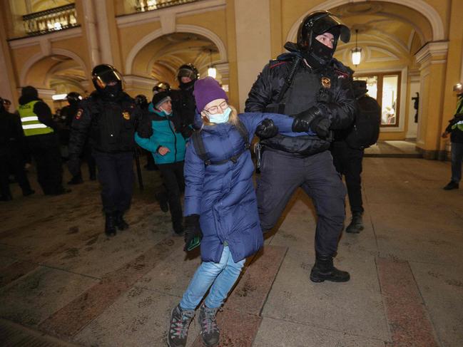 Police officers detain a demonstrator during a protest against Russia's invasion of Ukraine in central Saint Petersburg. Picture: AFP