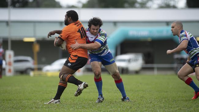 Tully Tigers’ Talliee Nomoa is tackled by Innisfail Leprechauns’ Rob Haren during a 16-all draw at Tully Showgrounds on Sunday, May 19, 2019. PIC: CHRIS HOLMES