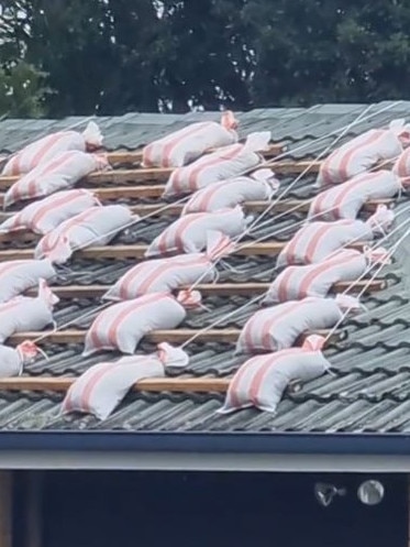 A resident covered their roof in sandbags.