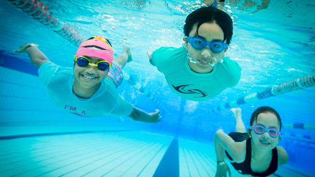 Lisara, Jamie and Angelina take a dip at Noble Park Aquatic Centre. Picture: Jake Nowakowski