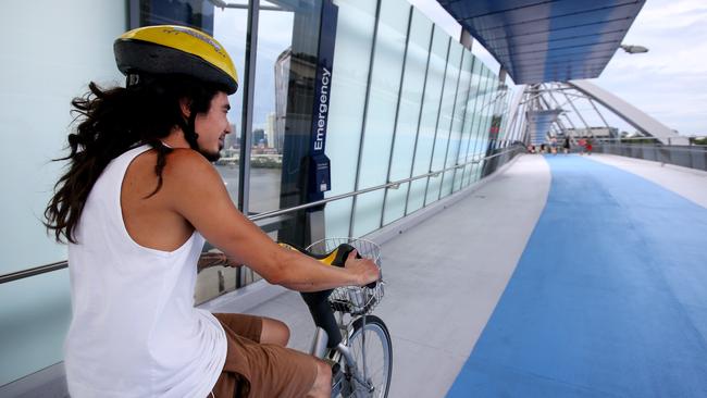 Jeremy Wright from Brisbane City, riding over the Goodwill Bridge. Picture: AAP/Steve Pohlner