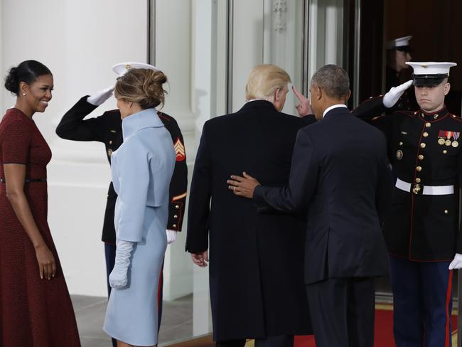 President Barack Obama escorts incoming President Donald Trump into the White House in Washington on January 20, 2017. Picture: AP