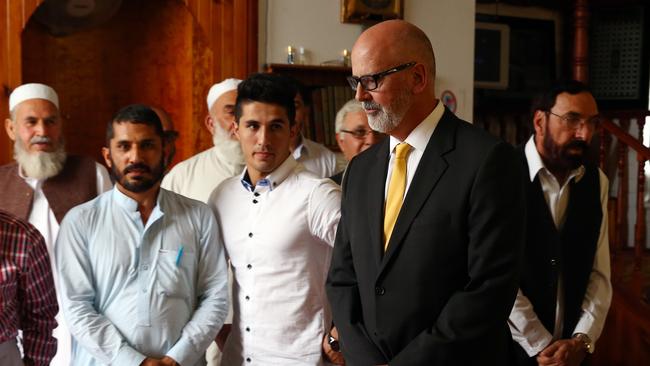 Andrew Holden with Abu Bakar Alam, second from left. Picture: Aaron Francis