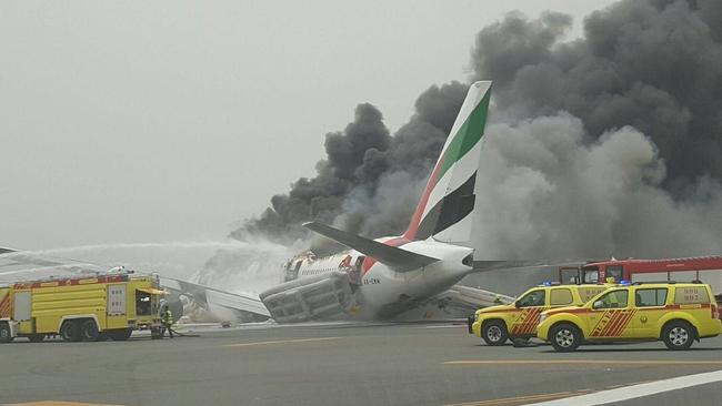 Fourteen people were taken to hospital after the Emirates plane from India crash-landed at Dubai International Airport. A firefighter was killed battling the blaze on the tarmac. Picture: Al Arabiya