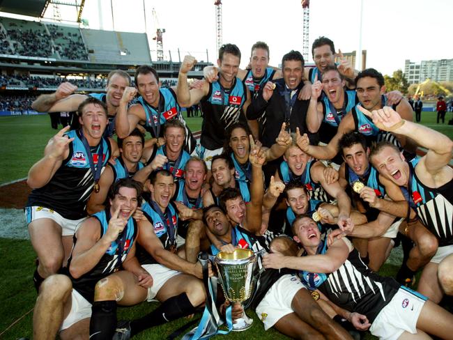 Port Adelaide Power footballers and Premiership cup trophy after win.AFL football - Brisbane Lions vs Port Adelaide Power grand final match at MCG 25 Sep 2004./Football/AFL