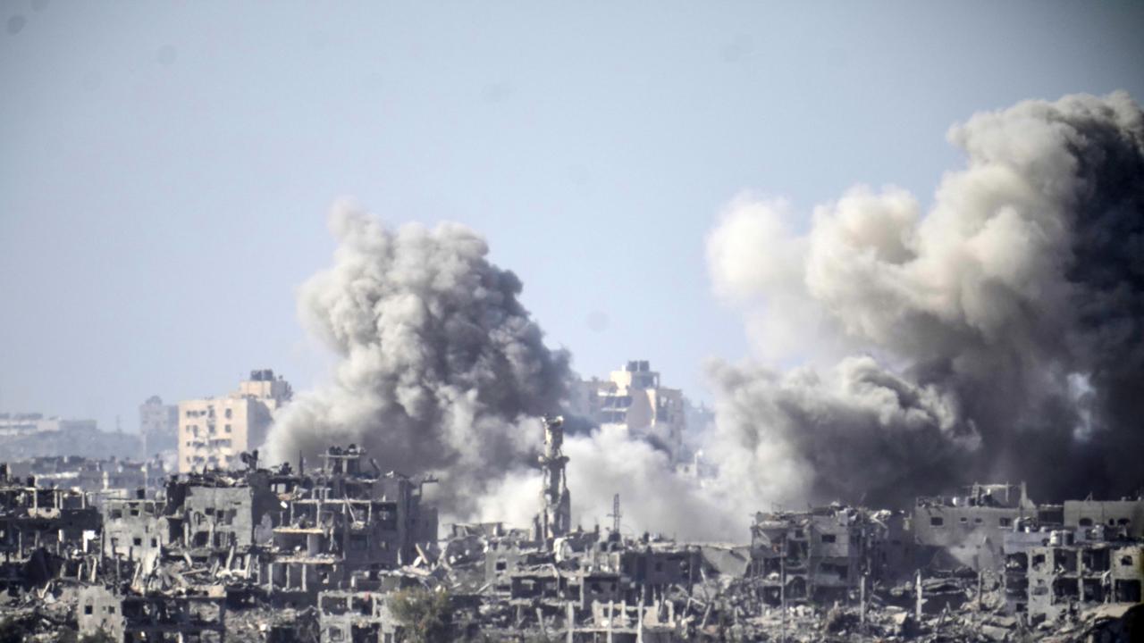 A plume of smoke follows an Israeli air strike in the northern part of the Gaza Strip. Photo: Christopher Furlong/Getty Images