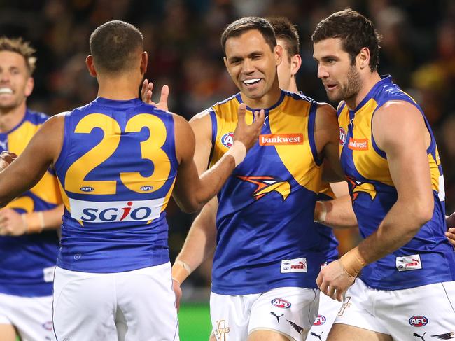 Josh Hill of the Eagles is congratulated by team mates after kicking a goal during the Round 23 AFL match between the Adelaide Crows and the West Coast Eagles at Adelaide Oval  in Adelaide, Friday, Aug. 26, 2016. (AAP Image/Ben Macmahon) NO ARCHIVING, EDITORIAL USE ONLY