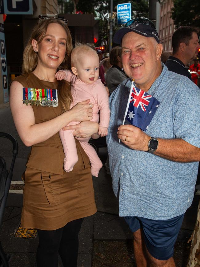 Thousands of people have braved the rain to gather in Brisbane for Anzac Day services. Picture: Grace Kessels