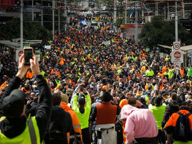 Construction workers march through the streets on September 21 in Melbourne over the introduction of mandatory Covid vaccinations for construction workers. Picture: Getty Images