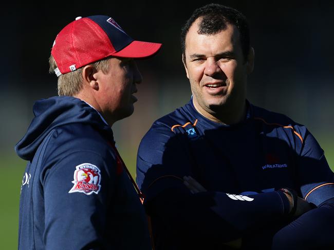 Sydney Roosters coach Trent Robinson with Waratahs coach Michael Cheika during the Sydney Roosters rugby league and Waratahs rugby combined training session at Moore Park, Sydney. Pic Brett Costello