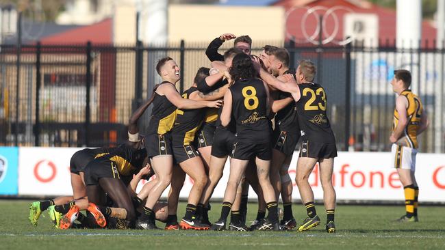 Sweet success: SPOS players embrace after the final siren. Picture: AAP/Dean Martin