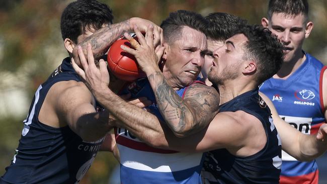 Central District’s James Boyd fights for possession. Picture: Naomi Jellicoe