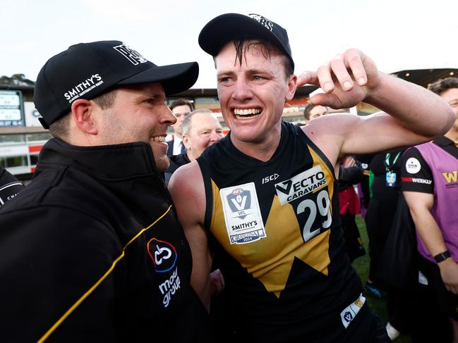 MELBOURNE, AUSTRALIA - SEPTEMBER 22: Werribee Coach Jimmy Allan and captain Dom Brew celebrate during the 2024 VFL Grand Final match between Werribee and the Southport Sharks at IKON Park on September 22, 2024 in Melbourne, Australia. (Photo by Michael Willson/AFL Photos via Getty Images)