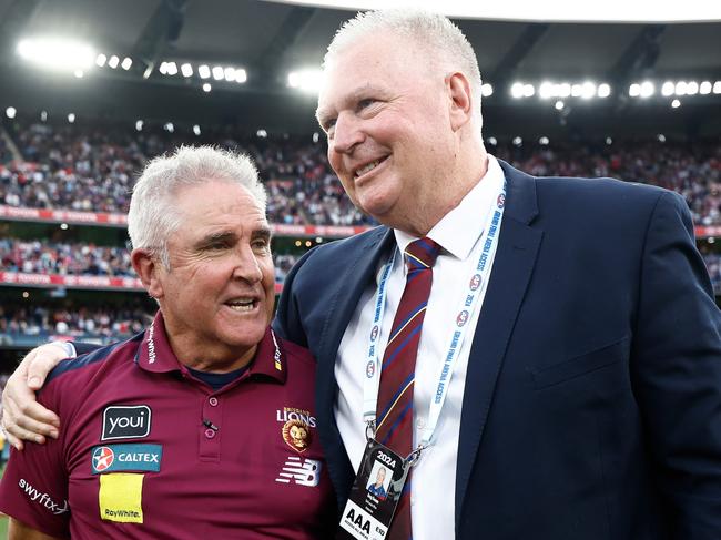 MELBOURNE, AUSTRALIA - SEPTEMBER 28: Chris Fagan, Senior Coach of the Lions and Greg Swann CEO of the Lions celebrate during the 2024 AFL Grand Final match between the Sydney Swans and the Brisbane Lions at The Melbourne Cricket Ground on September 28, 2024 in Melbourne, Australia. (Photo by Michael Willson/AFL Photos via Getty Images)