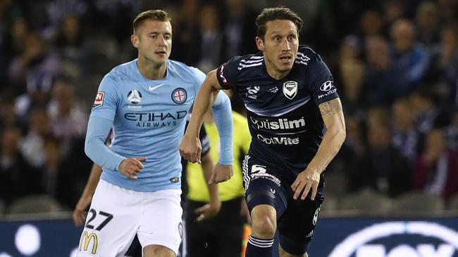 Socceroo Mark Milligan in action for Melbourne Victory against Melbourne City on Saturday night.